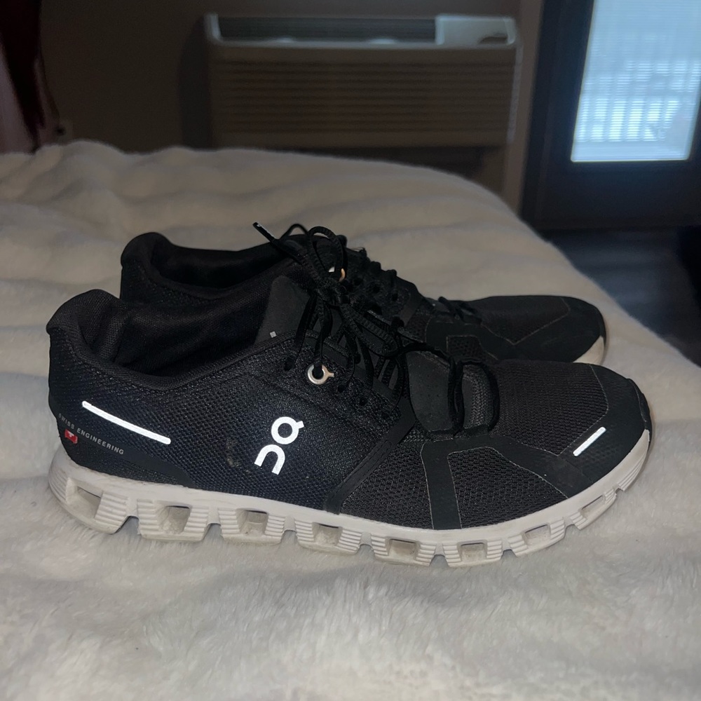 Black cloud on running sneakers